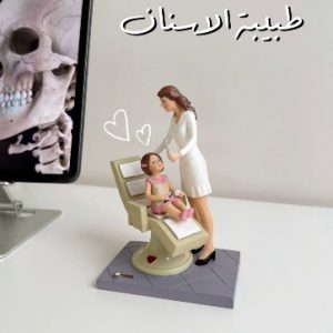 A Female Dentist Sculpture Treating her Baby Patient