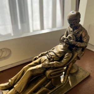 Dental Sculpture, A Male Dentist Working on a Patient